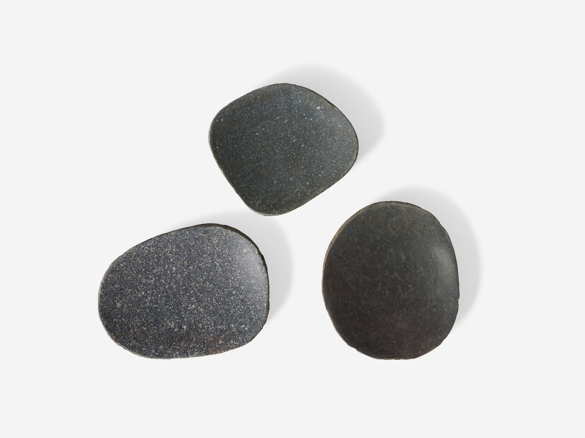 Three natural stone platform plates top view